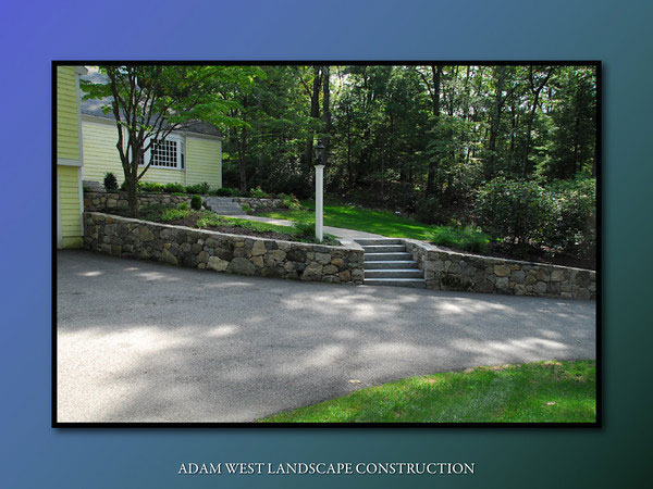 Stone driveway retaining wall