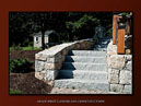 Paver parking, fieldstone walls, granite steps